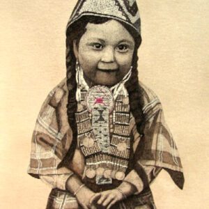 A child dressed in native american clothing.